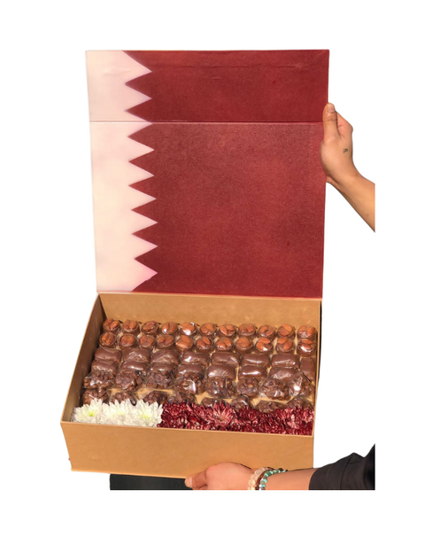 Melia box Qatar flag design with chocolate and flowers